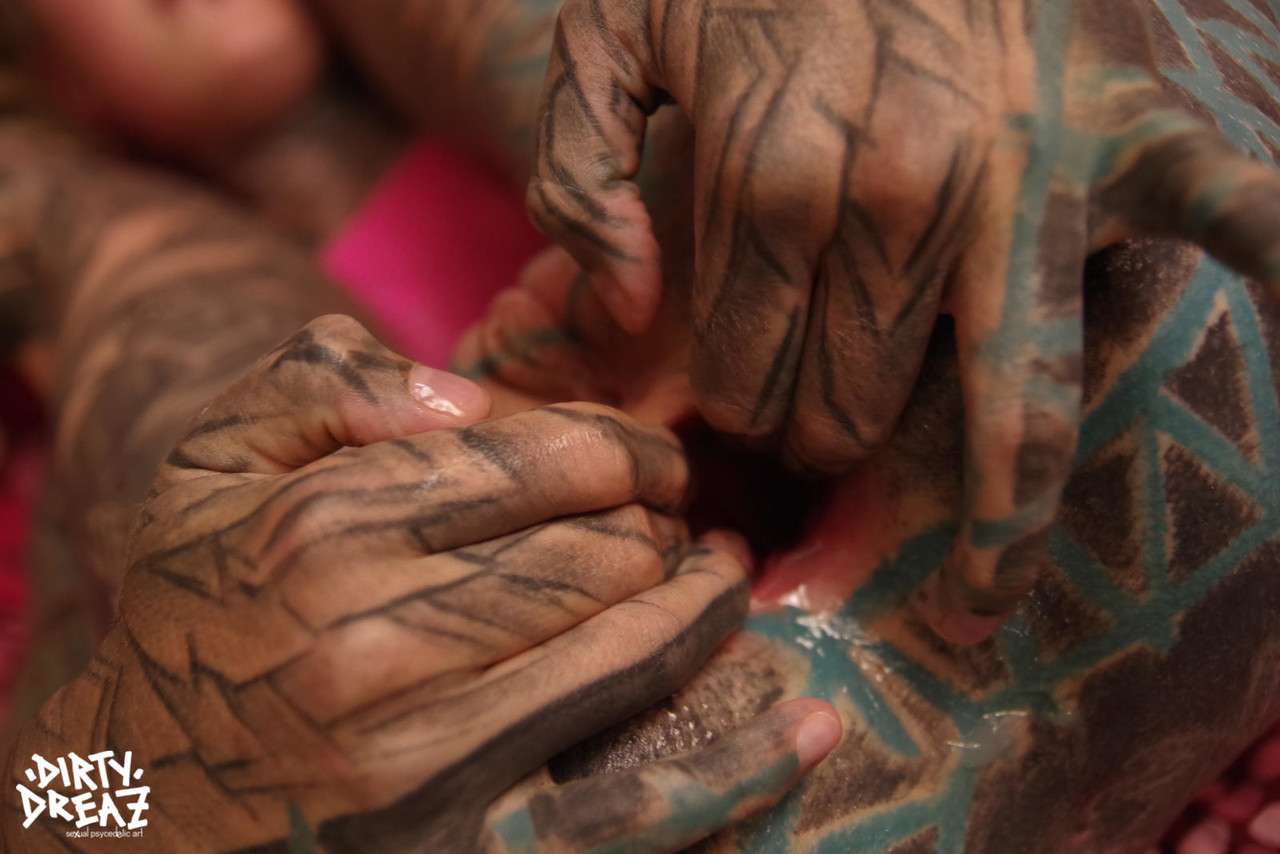 A heavily tattooed woman stretches her anus with her fingers while having a deep, painful rump.