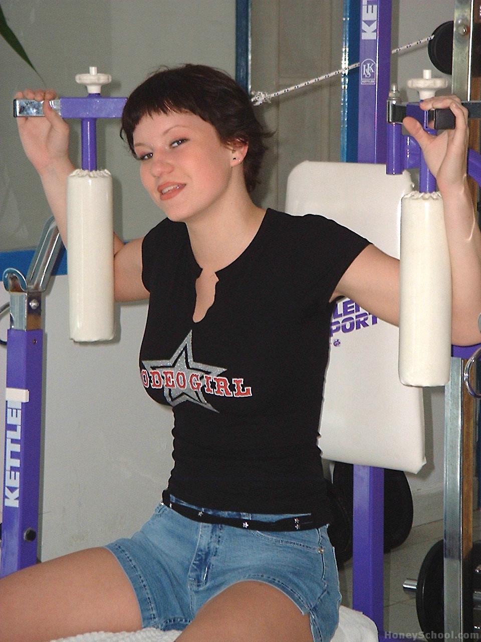 Big titted teen sports short hair while getting naked during a working out foto porno #428604860