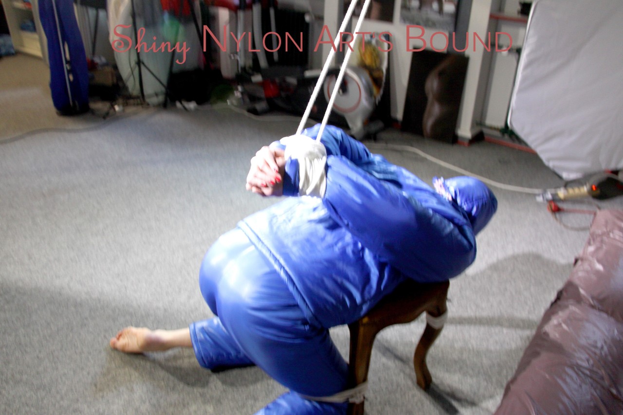 PIA tied, gagged and hooded on a stool and on the ceiling wearing a supersecy