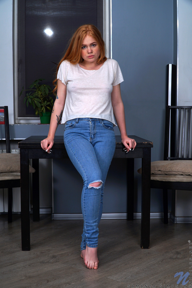 Hot redhead Samanta Simpson peels off ripped jeans on her way to posing naked porn photo #428760640