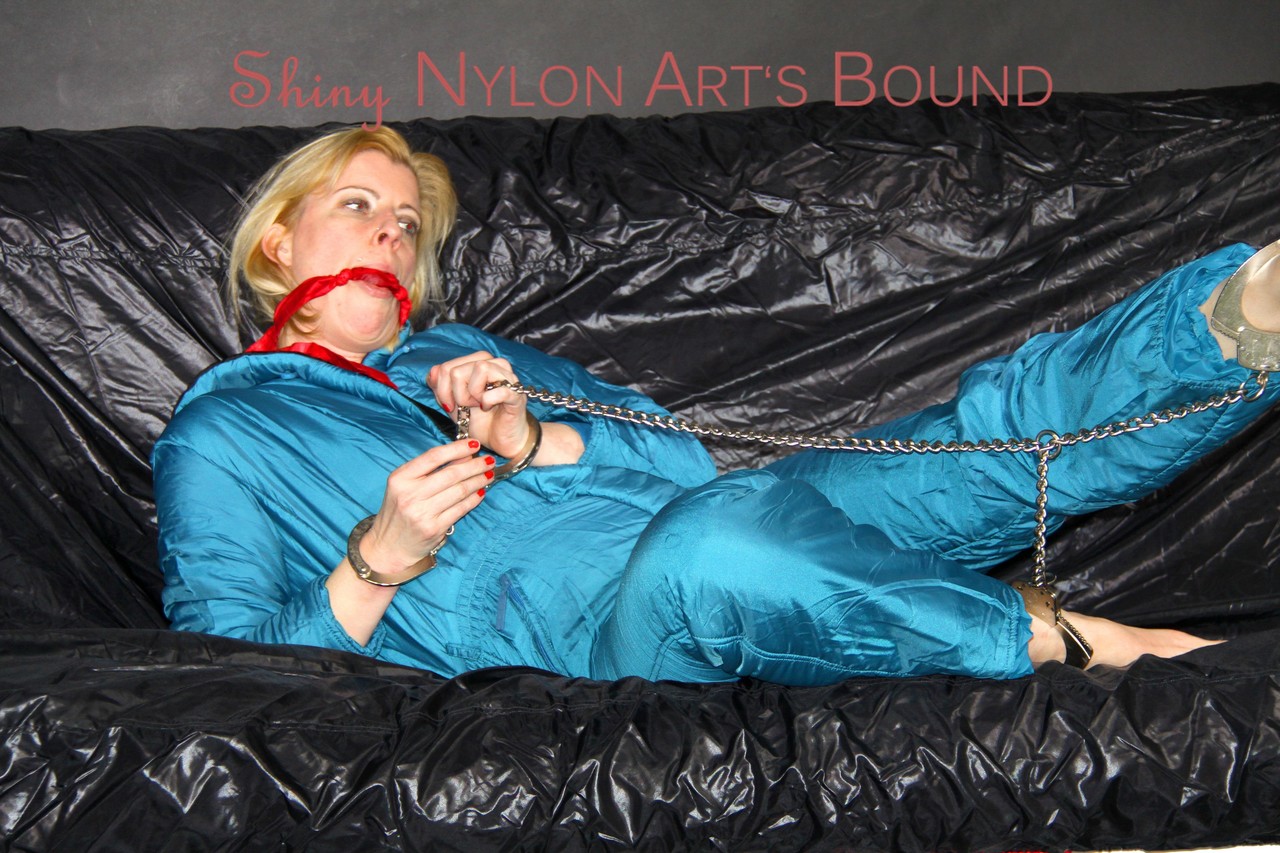 The super-cute oldschool downsuit with green ties and Pia's gagging pose on the floor.