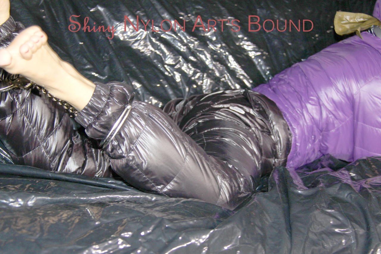 Sandra had her hands tied and gagged on a couch, while wearing cuffs and an ornate pillory in hot purple.