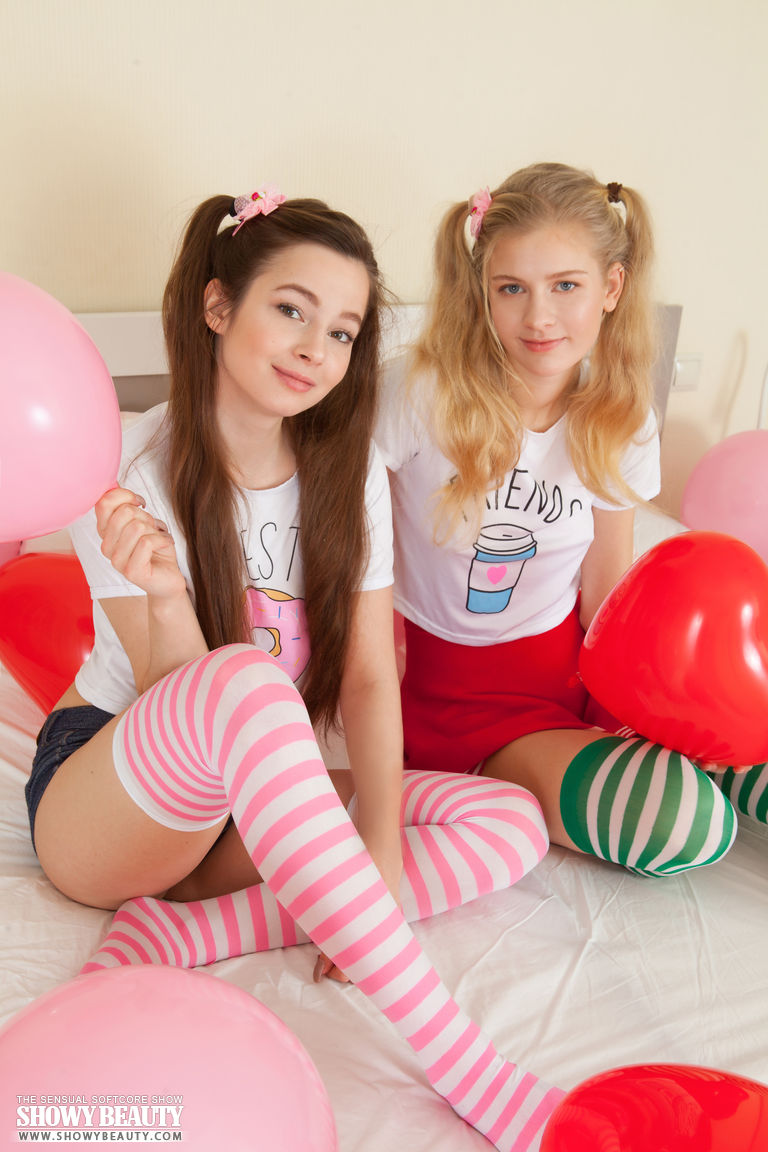 Young looking lesbians Amy & Angela remove their striped thigh highs together foto porno #424590738