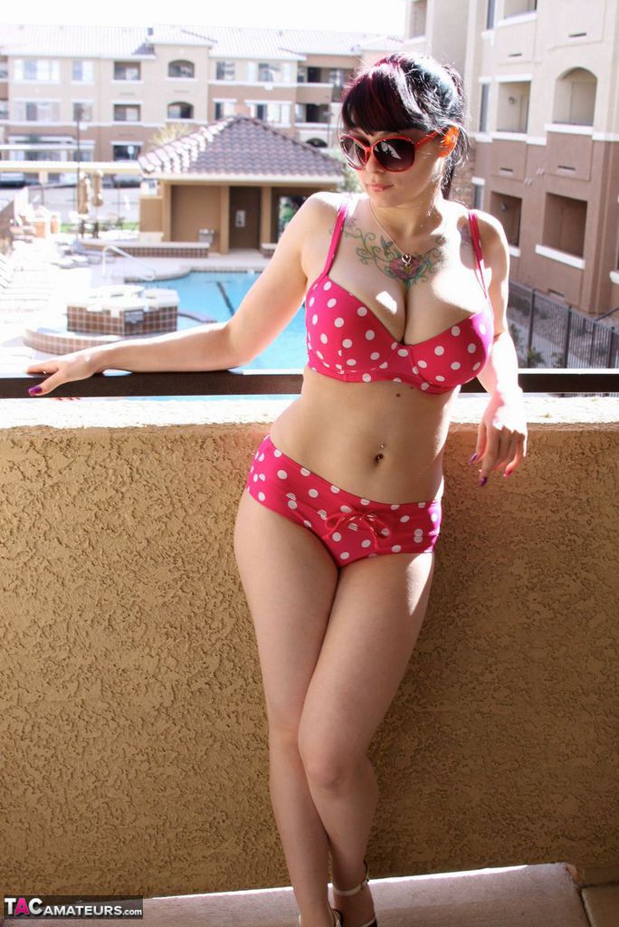 Amateur girl Susy Rocks models a polka-dot bikini in shades on a balcony porno foto #426957160
