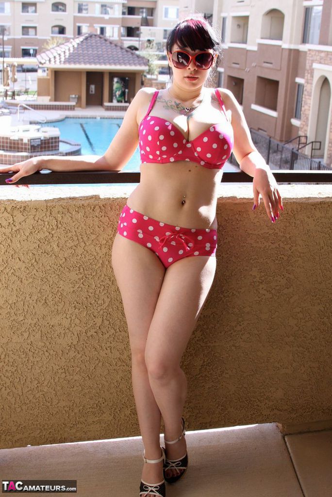 Amateur girl Susy Rocks models a polka-dot bikini in shades on a balcony porno foto #426957166