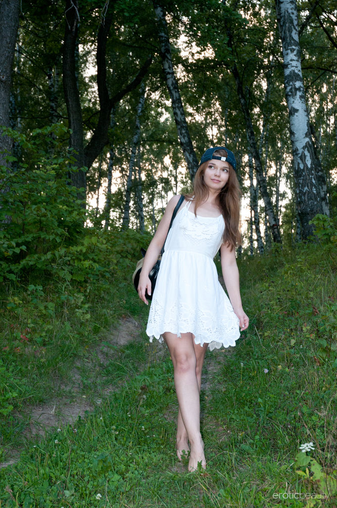 Cute teen Nedda A takes off a white dress to pose nude on a fallen tree foto porno #427761461