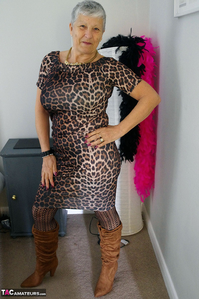 Old woman Savana doffs an animal print dress to pose nude in stockings & boots foto porno #423812481