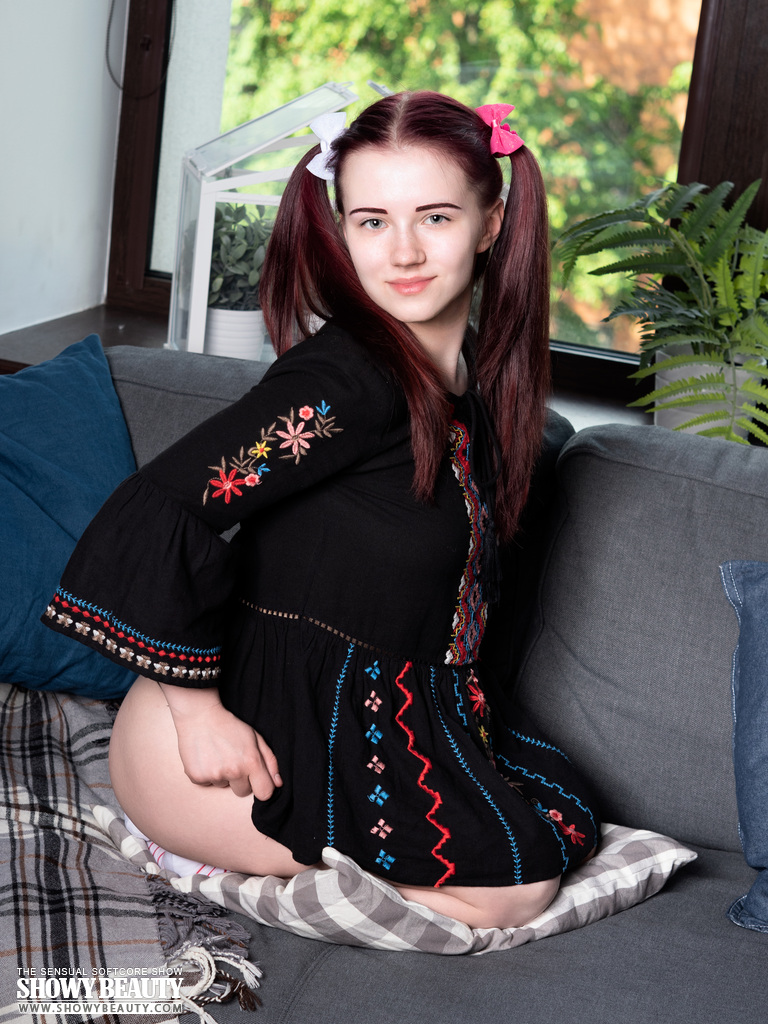 Young looking teen Polina strips to her socks on a sofa in pigtails porn photo #426993472