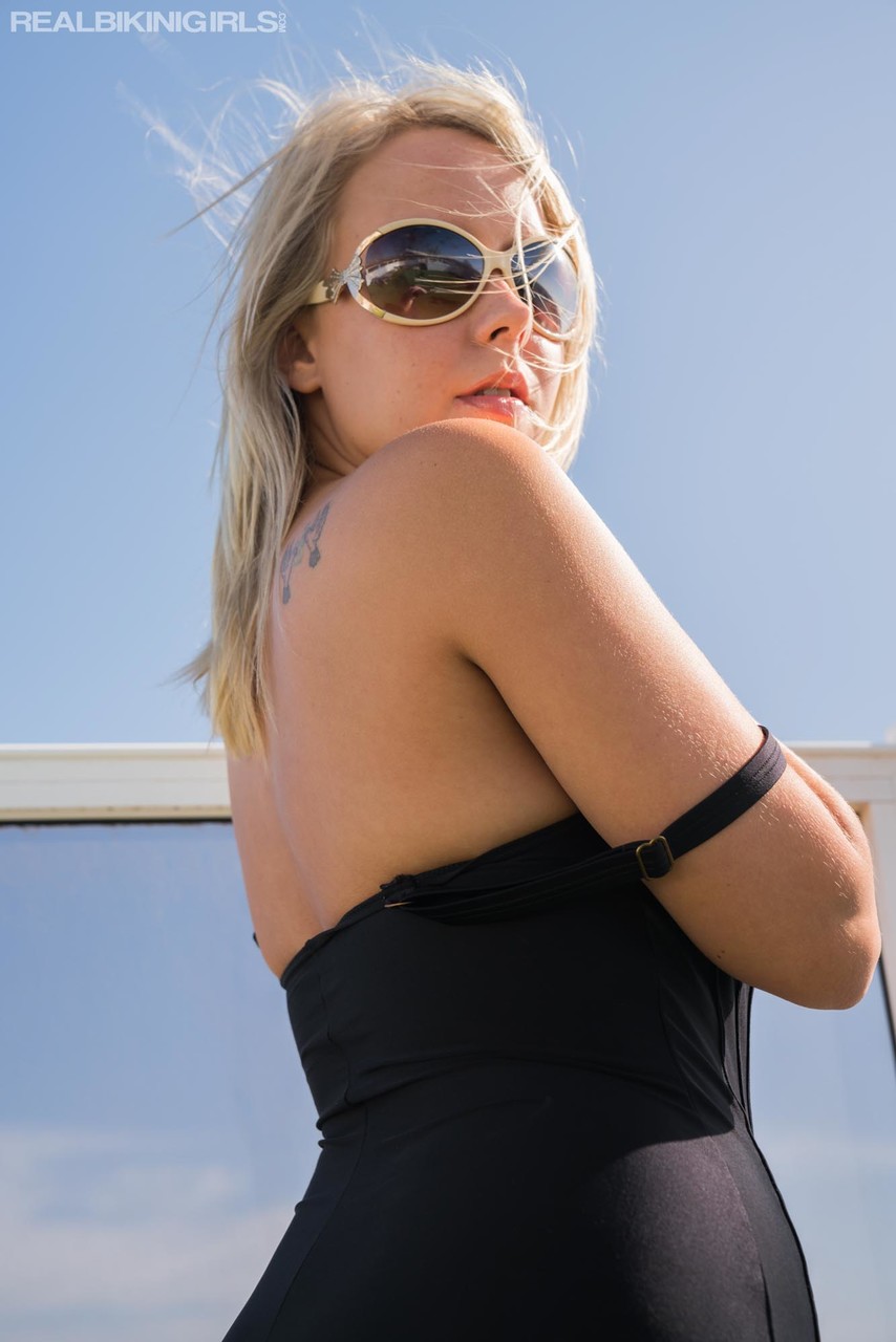 Hot blonde frees her nice tits from a swimsuit on a rooftop in designer shades photo porno #428195426
