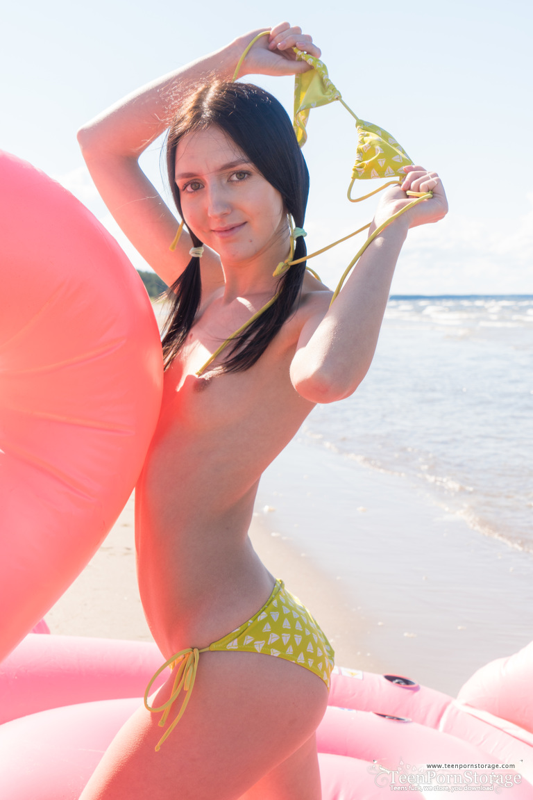 Girl next-door type doffs her bikini before finger fucking on an inflatable Porno-Foto #427407776