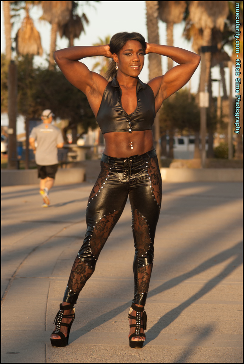 Ebony bodybuilder Jaquita Person Taylor flexes while walking her dogs porn photo #423457822