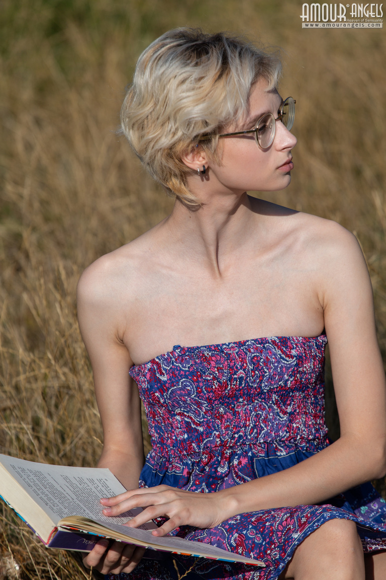 Nerdy female ditches her book and glasses before getting naked in a field photo porno #424648033