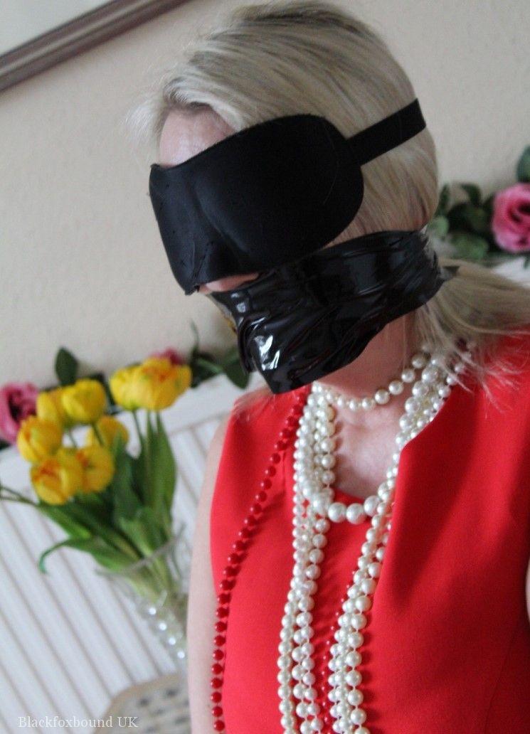 Older Blonde Is Tied Up Gagged And Blindfolded In A Few Outfits