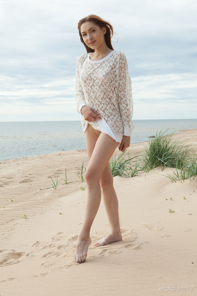Young Beauty Lena Raz Gets Completely Naked On A Sandy Beach