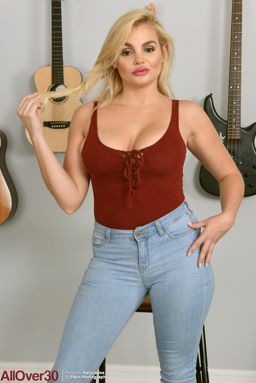 Over 30 blonde Katy Jayne uncovers her nice tits as she strips afore guitars porn photo #428402858