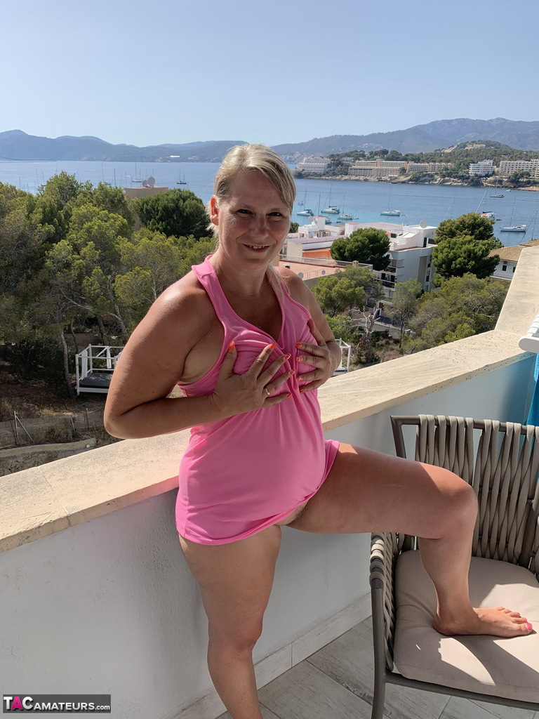 Thick older blonde twerks her big ass on a balcony after exposing herself porn photo #423969966