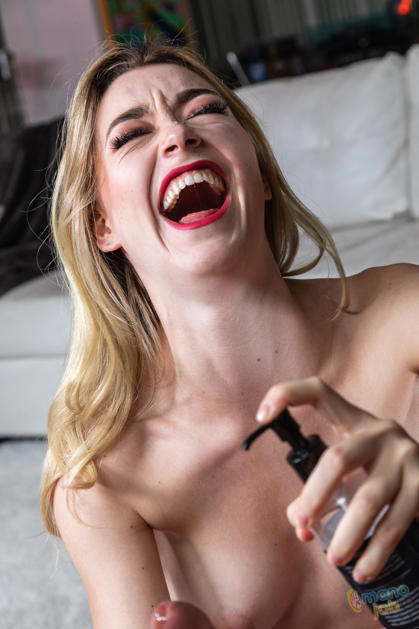 Sexy blonde with red lips takes an upskirt selfie before giving a handjob porno foto #425438209