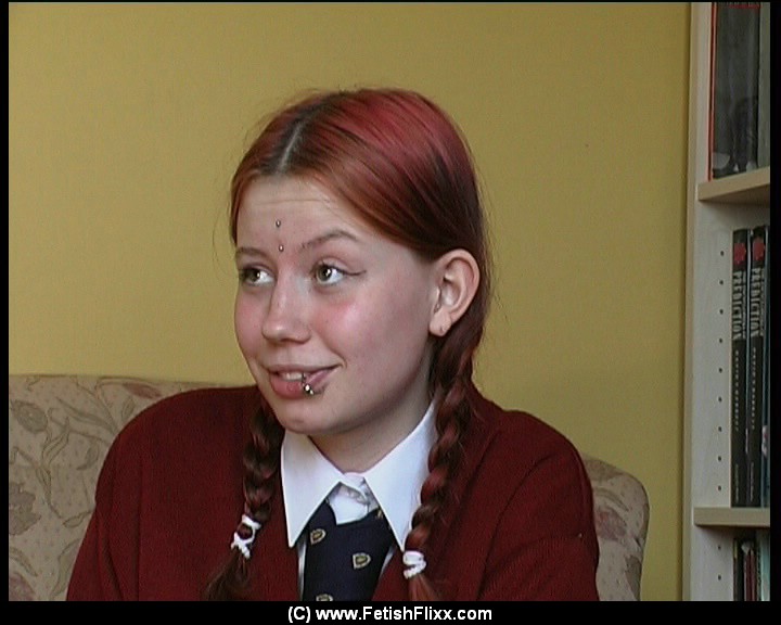 Redheaded student has her bare bottom turned pink during a caning session foto porno #426437935