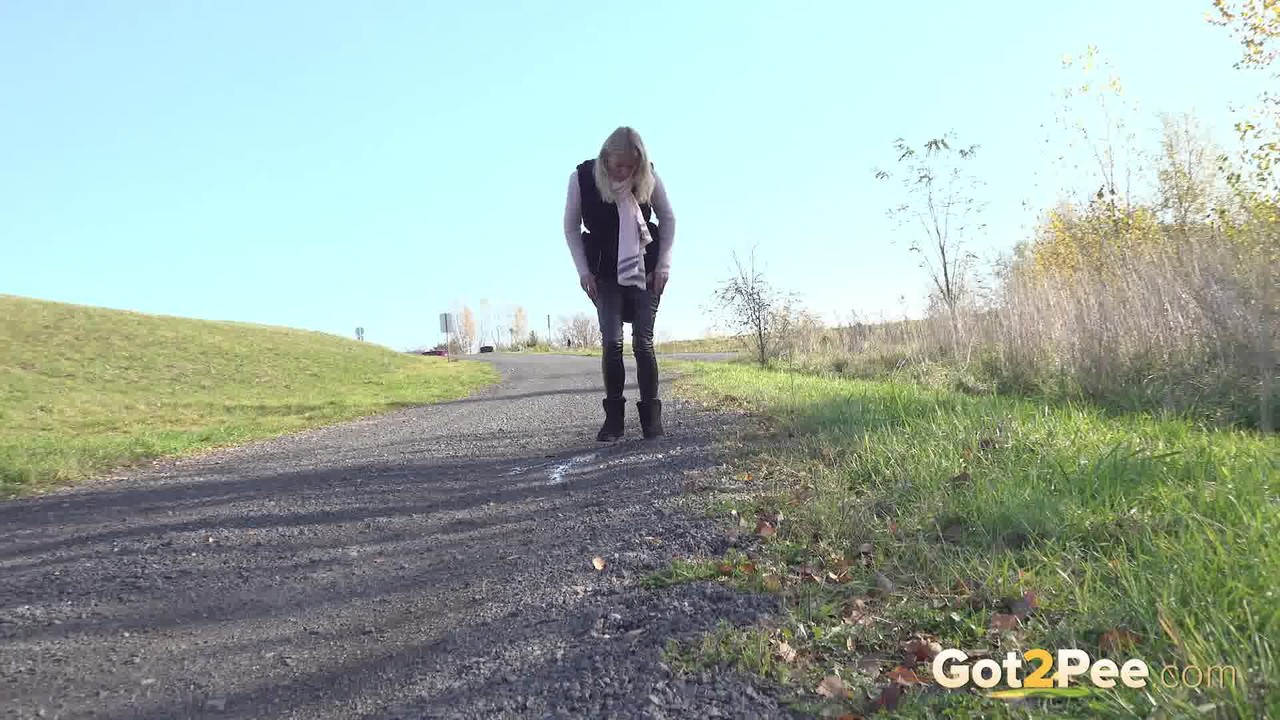 Blonde girl Claudia Macc takes a piss on a gravel walking path porn photo #424894578