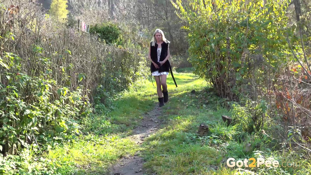 Blonde girl Claudia Macc spreads her pussy lips while taking a pee in nature foto porno #425347866