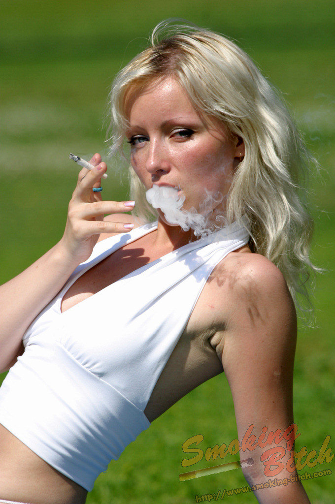 Hot blonde smokes a cigarette during upskirt action on a public bench porno fotky #424141697