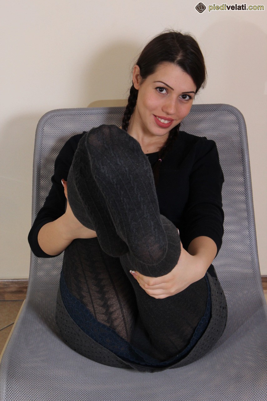 Fully clothed female Petra frees her black hose clad feet from Ugg slippers porn photo #427648607