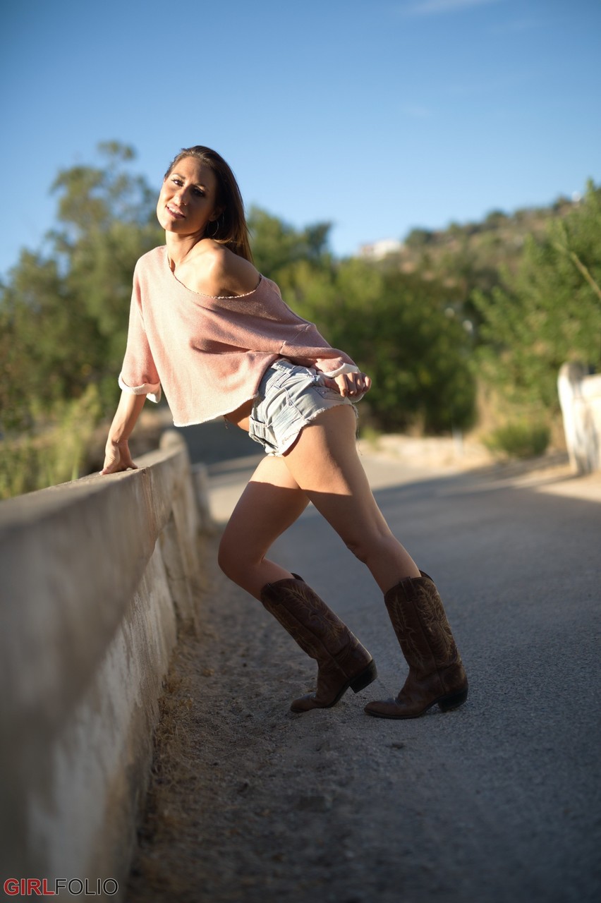 Solo model Jess West walks along a road in nothing more than her cowgirl boots porn photo #427290833
