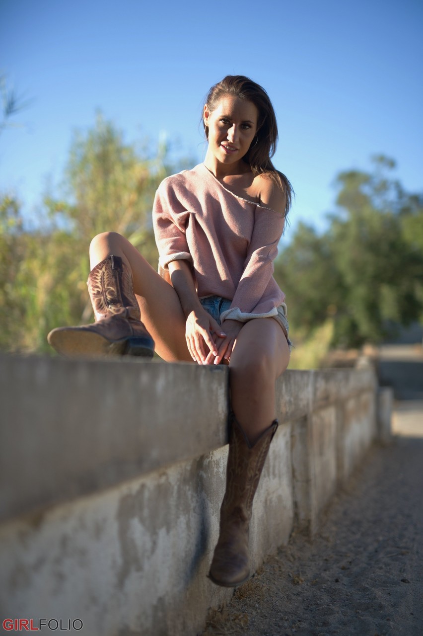 Solo model Jess West walks along a road in nothing more than her cowgirl boots porn photo #427291050
