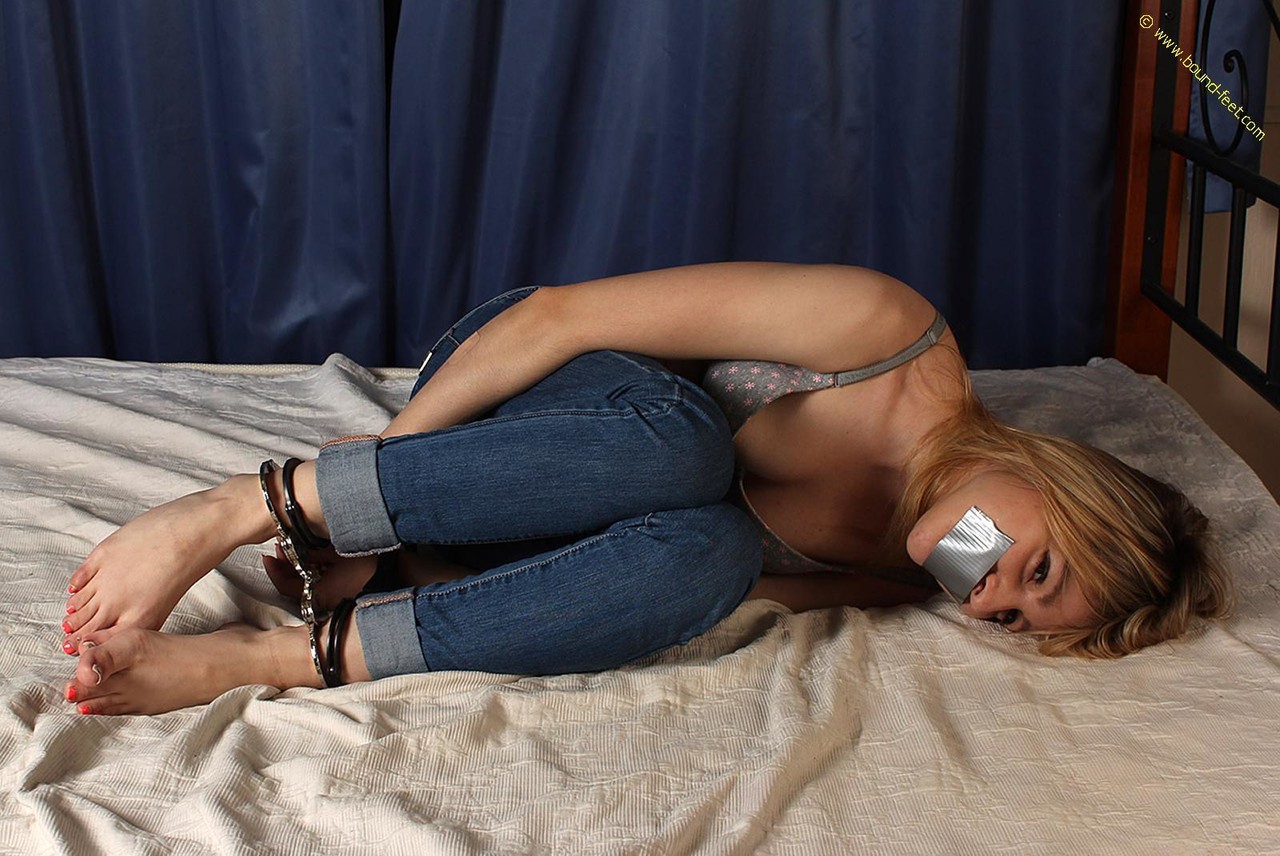 Caucasian girl is silenced with duct tape while wrist and hand cuffed porn photo #428625058