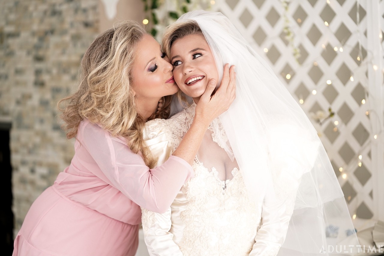 Carolina Sweets is affixed with a garter before a lesbian wedding to Julia Ann porn photo #424399696