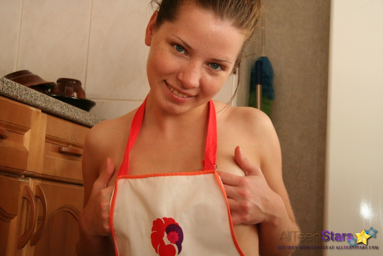 Charming Teen Kimmy Takes Off A Kitchen Apron While Going Nude At Home