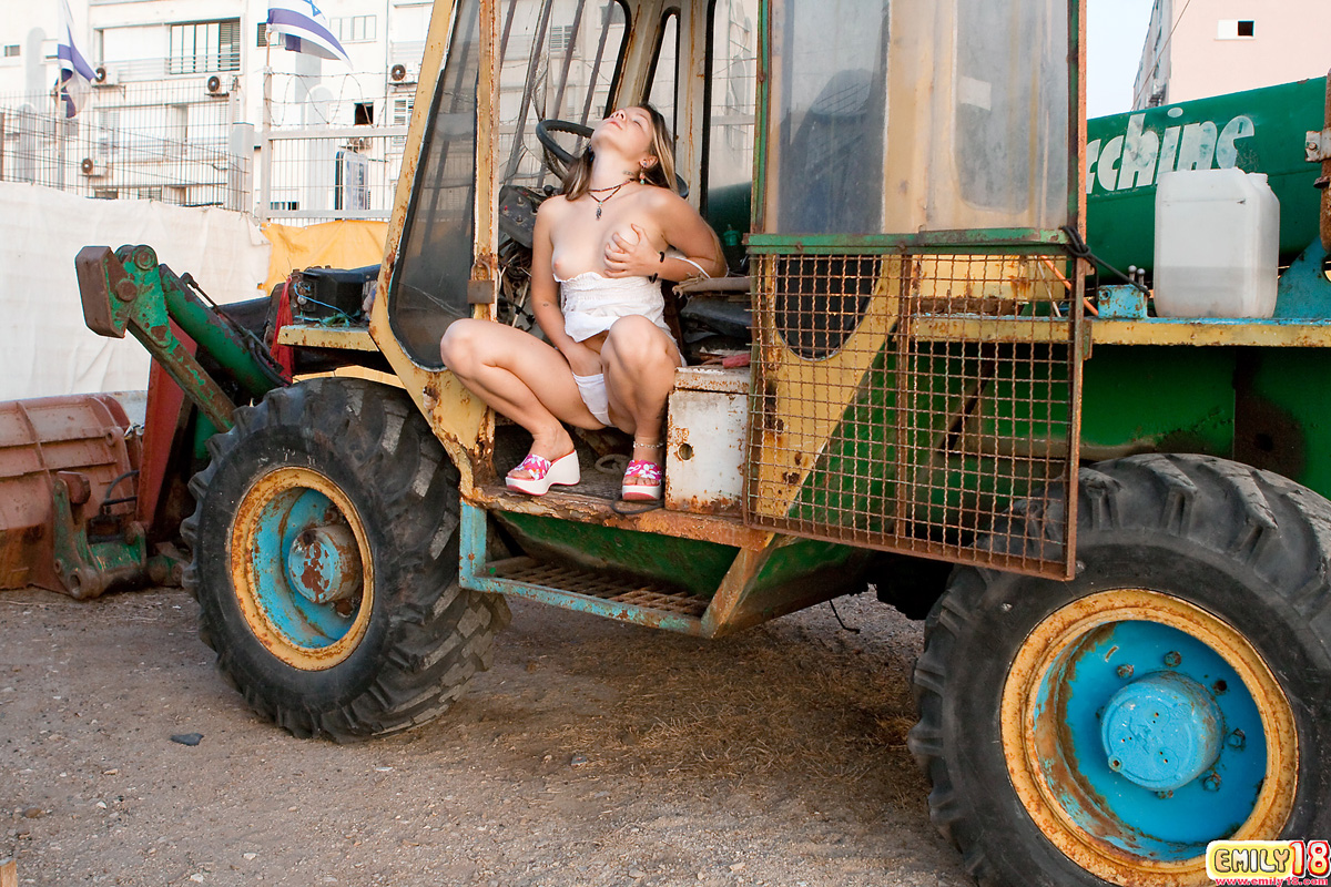 Cute 18 year old exposes her tiny tits and thong on heavy equipment porn photo #426539837