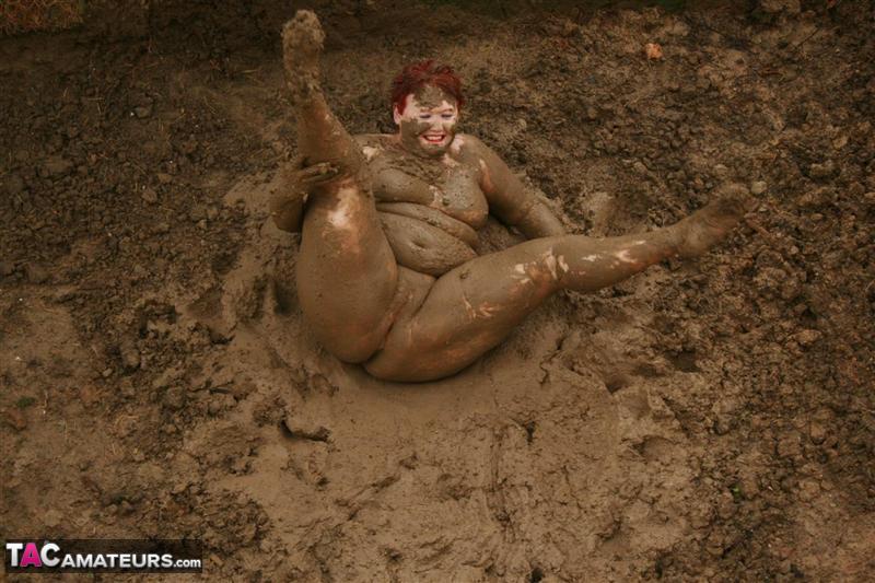 Older redhead Valgasmic Exposed rolls around in a mud pit while totally naked porno fotoğrafı #424348644