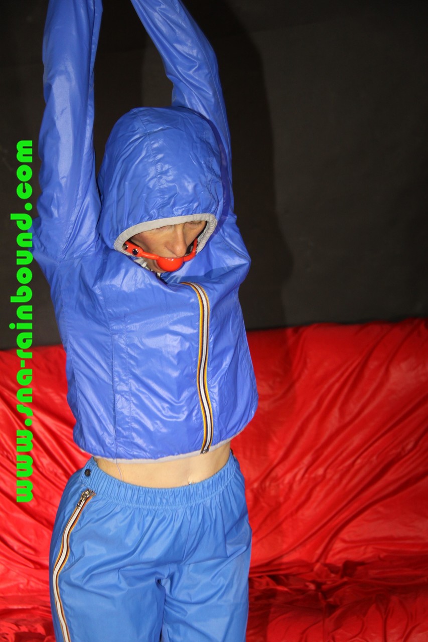 Sexy Sonja being tied and gagged overhead with ropes wearing a sexy blue shiny porn photo #422734484