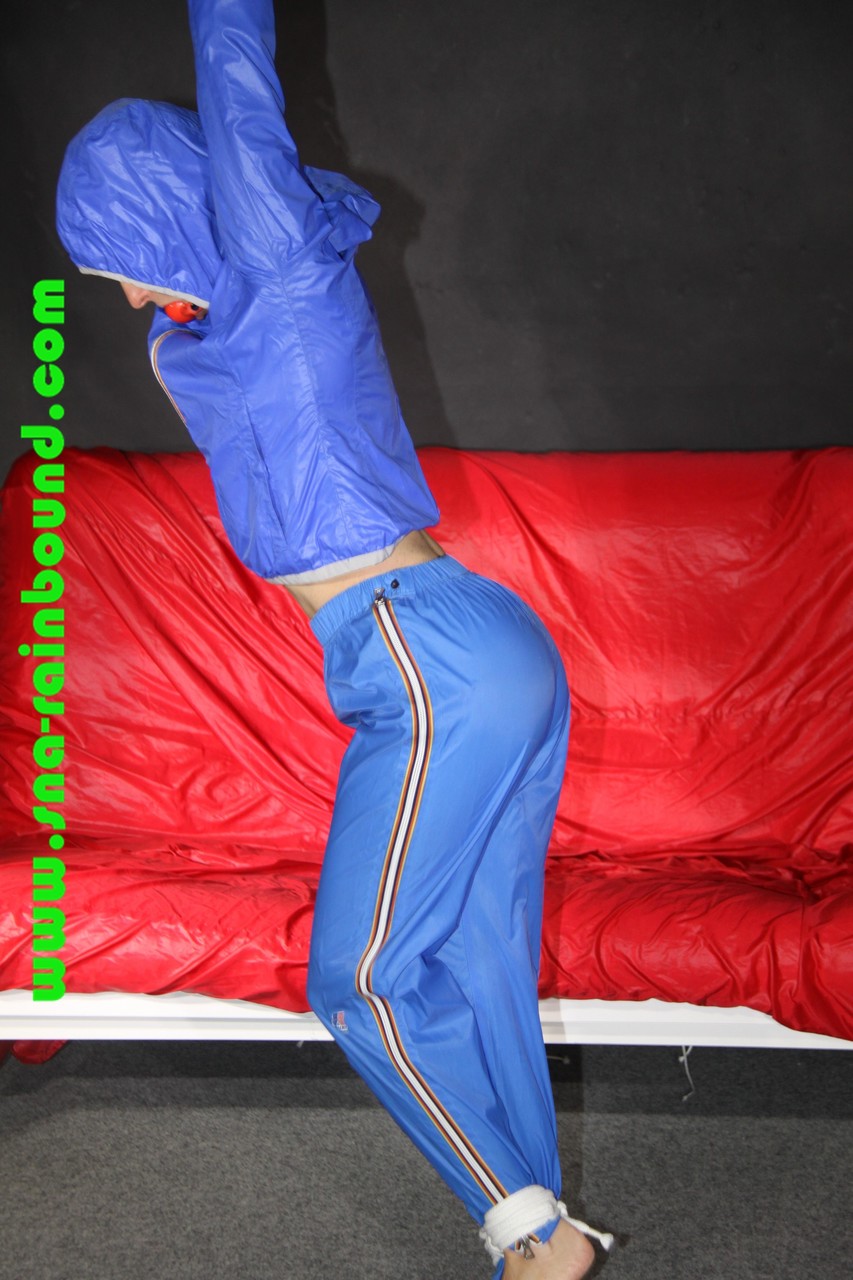 Sexy Sonja being tied and gagged overhead with ropes wearing a sexy blue shiny foto porno #422734501