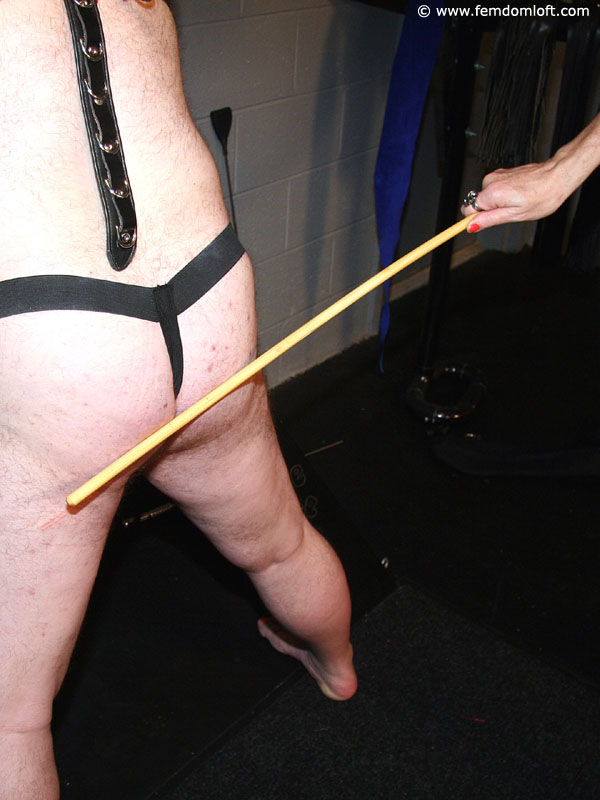 Mature blonde Mistress using her cane and leather strap to make a male suffer porn photo #422766459