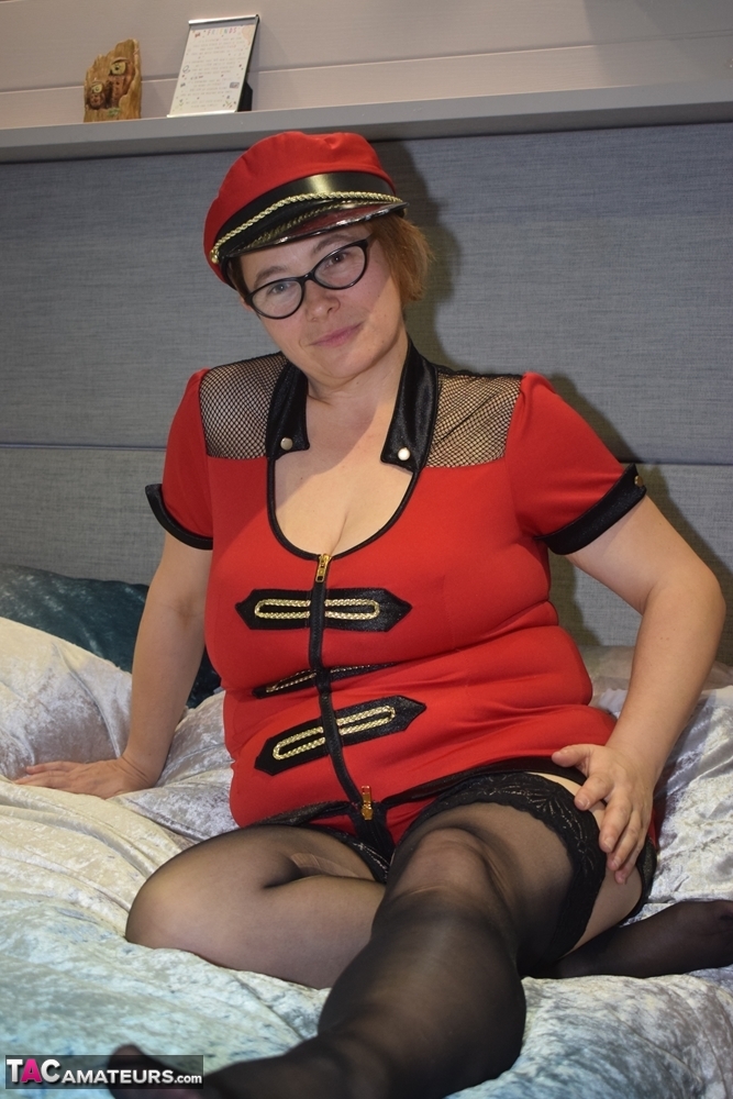 Older first timer looses her saggy breasts from her uniform on a bed photo porno #423154179