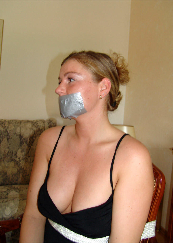 Clothed female removes duct tape from over her mouth while restrained to chair porn photo #426373307 | Bound Studio Pics, Bondage, mobile porn