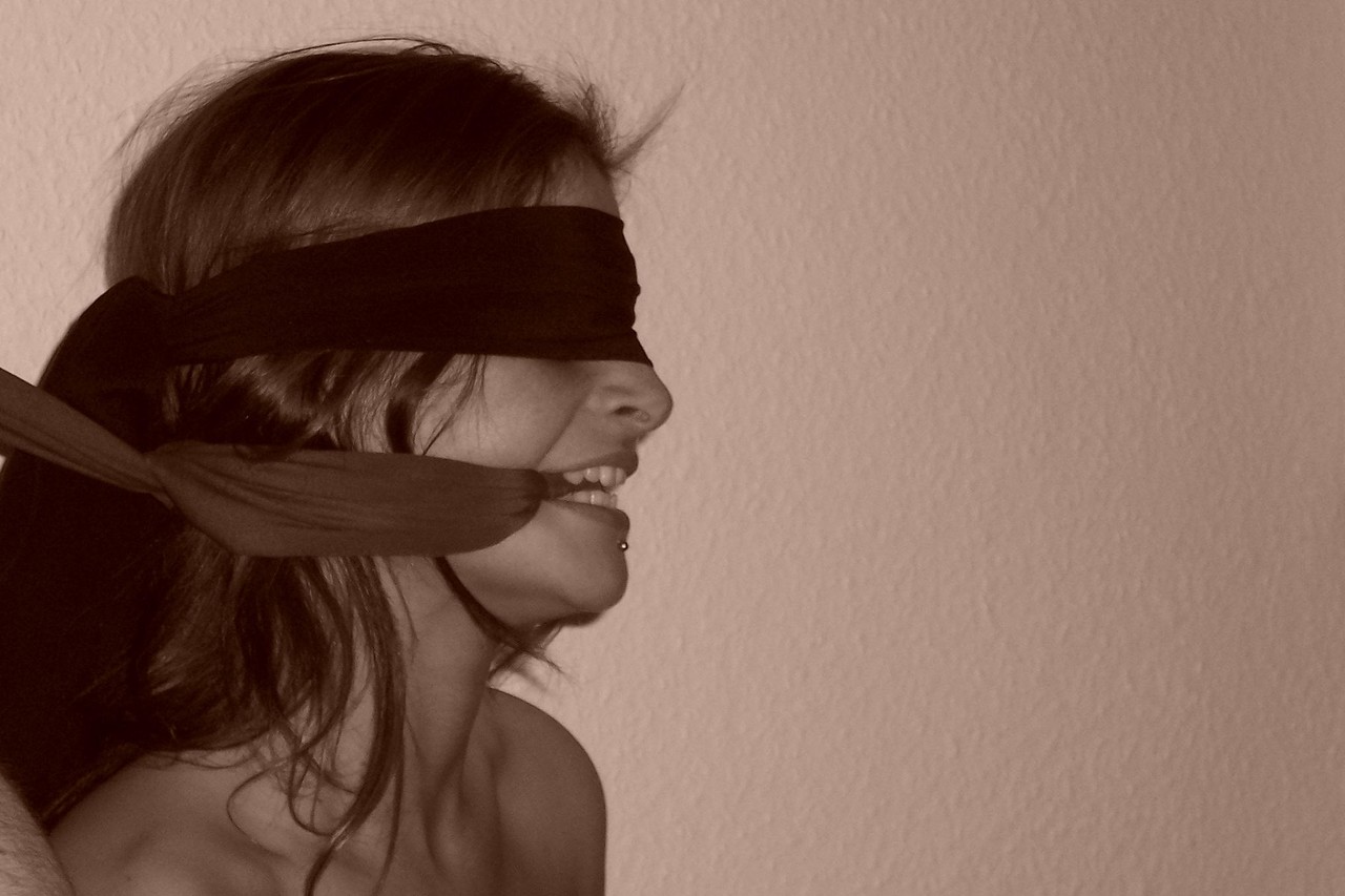 Restrained redhead struggles against her bindings while blindfolded and gagged porn photo #424861739