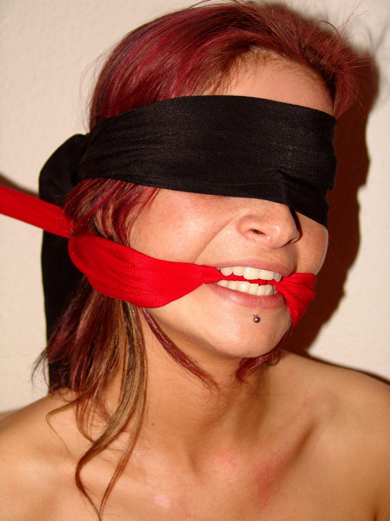 Restrained redhead struggles against her bindings while blindfolded and gagged 色情照片 #424861742