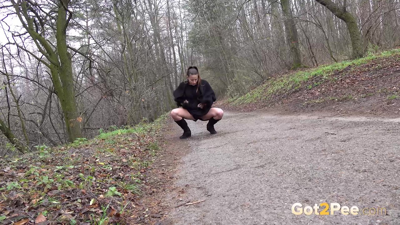 Brunette Yenna squats and pisses on a path outside порно фото #428423122
