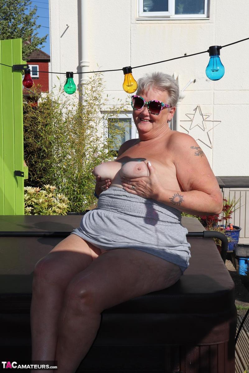 Fat nan Valgasmic Exposed licks a shoe while exposing herself in the backyard porn photo #423865086