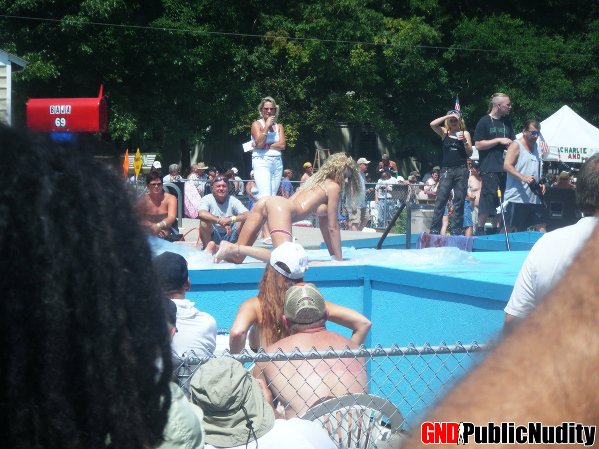 Naked strippers decorate the stage during an outdoor festival porn photo #426426532