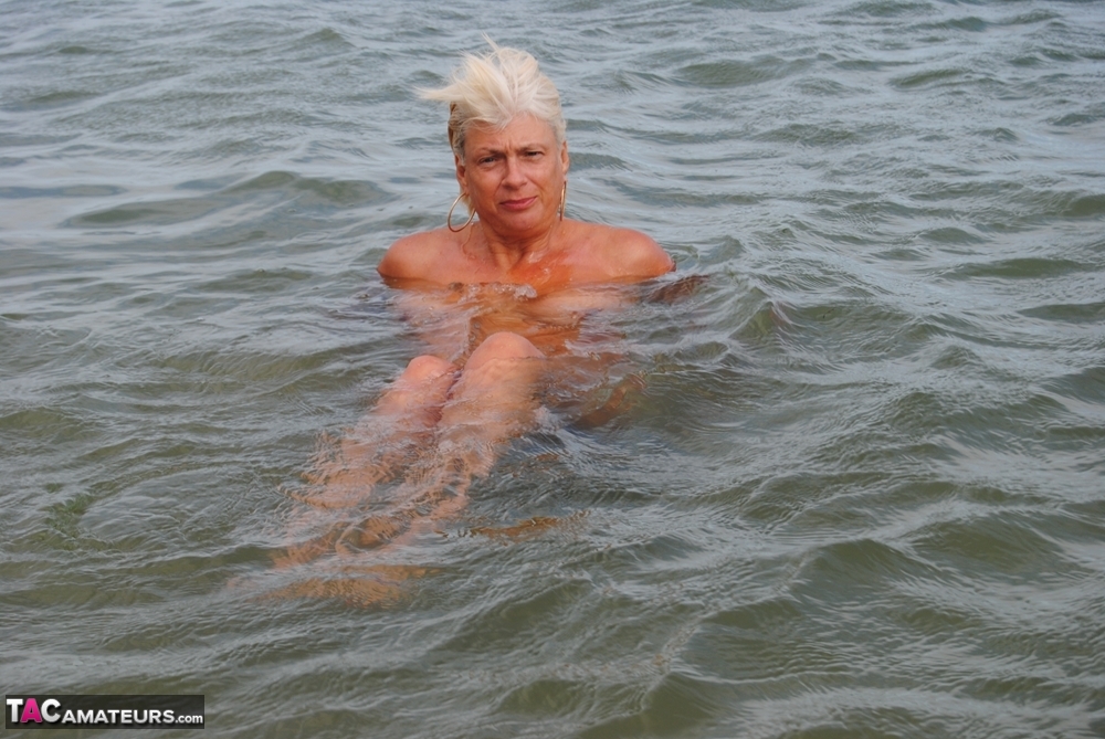 Older platinum blonde Dimonty takes a dip in the ocean while totally naked photo porno #425641756