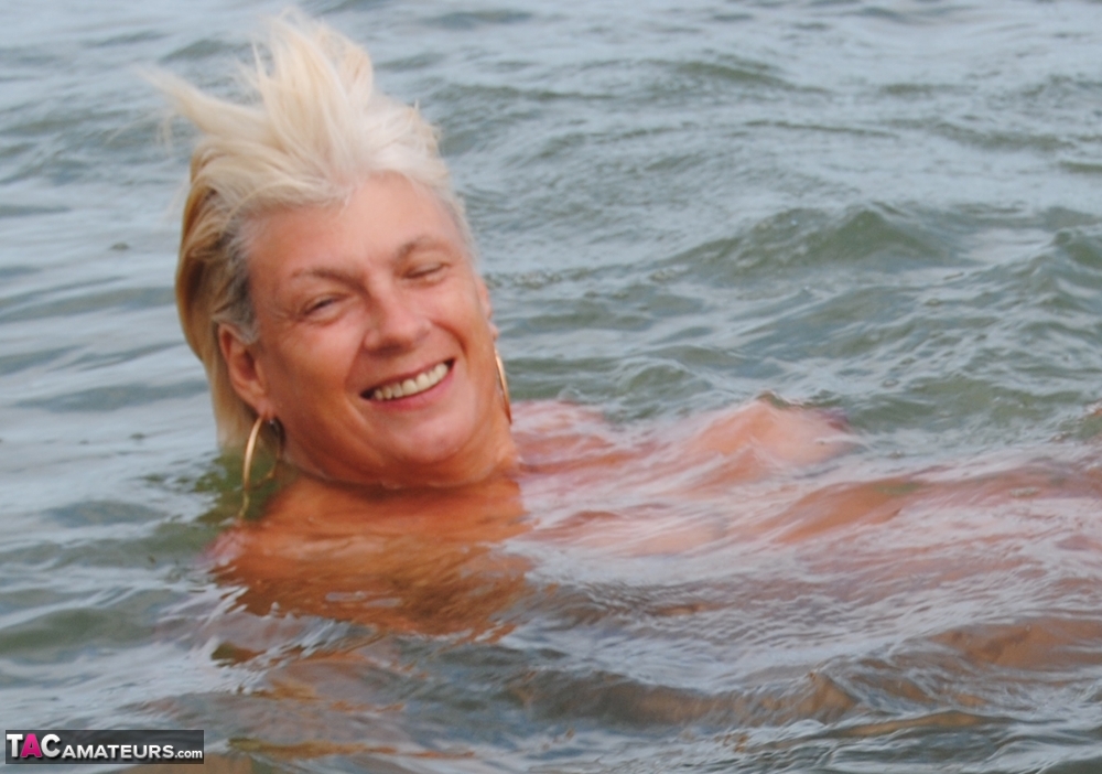 Older platinum blonde Dimonty takes a dip in the ocean while totally naked porno fotky #425641769