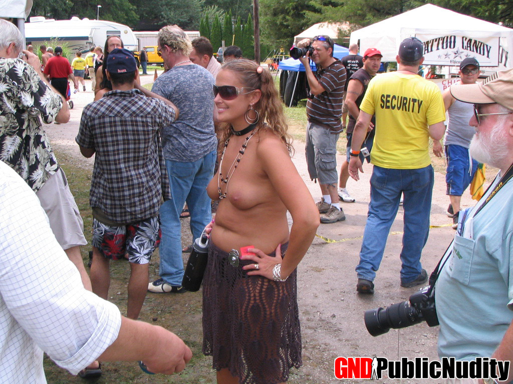 Multiple strippers on stage showing off at an outdoor public nudity party ポルノ写真 #428714832
