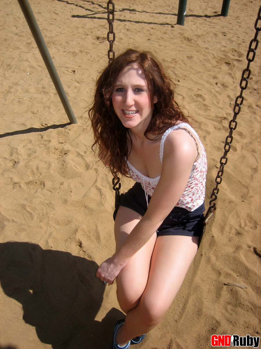 Red headed cock tease Ruby plays on the swing set at the public park porno foto #428680060