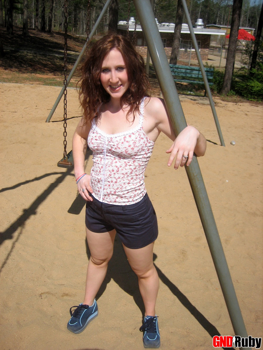 Red headed cock tease Ruby plays on the swing set at the public park porn photo #428680062