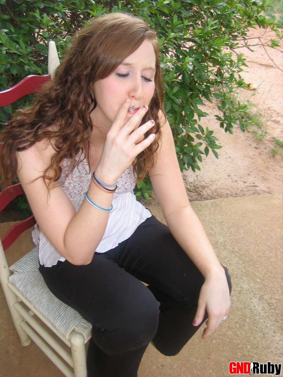 Sexy red head teen Ruby takes a smoke break and flashes the camera porn photo #422510636