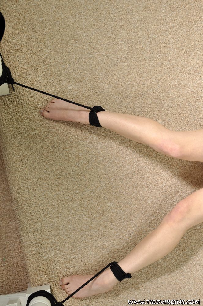 Naked redhead sports a ball gag while tied to furniture on carpeted flooring foto porno #428496654